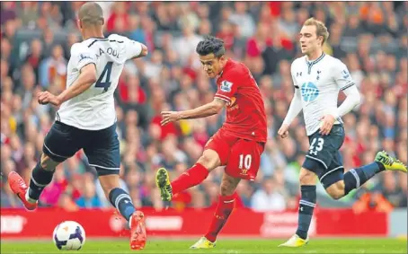  ?? Picture: Getty Images. ?? Philippe Coutinho scores the third goal during Liverpool’s win over Tottenham on Sunday.