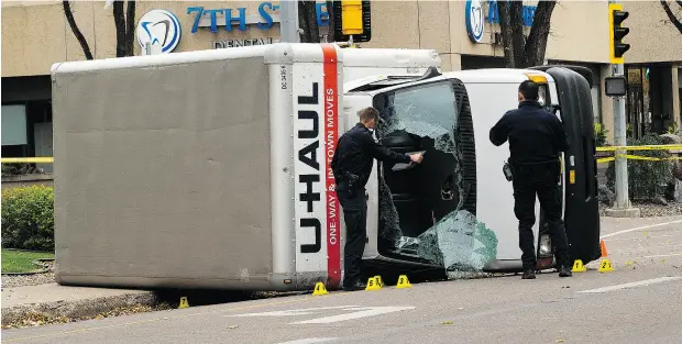  ?? GREG SOUTHAM / POSTMEDIA NEWS ?? Edmonton police investigat­e a U-Haul truck on Sunday after a 30-year- old man allegedly struck a police officer, then stabbed the officer, and then proceeded to hit four more people with the vehicle. Abdulahi Hasan Sharif made his first appearance in...