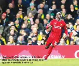  ?? Photo: AP ?? Liverpool’s Sadio Mane celebrates after scoring his side’s opening goal against Norwich.