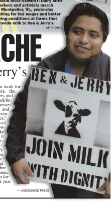  ?? AP PHOTOS ?? LABOR MOO-VEMENT: Dairy farm workers and activists march in Montpelier, Vt., yesterday calling for fair wages and better living conditions at farms that provide milk to Ben & Jerry’s.