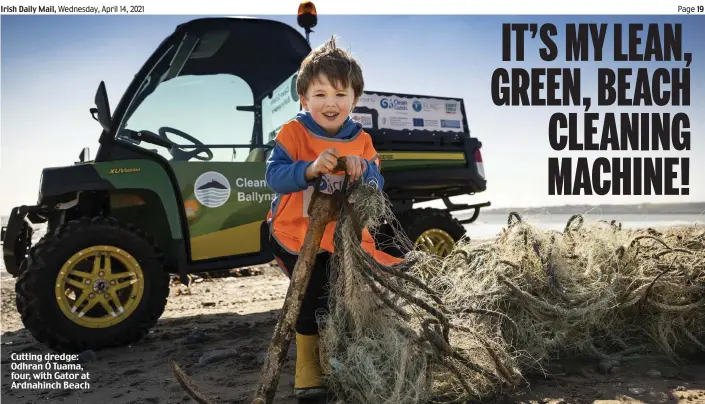  ??  ?? Cutting dredge: Odhran Ó Tuama, four, with Gator at Ardnahinch Beach