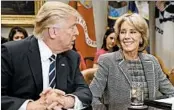  ?? EVAN VUCCI/AP ?? President Donald Trump talks to Education Secretary Betsy DeVos at the White House earlier this year.