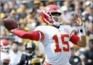  ?? DON WRIGHT — THE ASSOCIATED PRESS ?? Kansas City Chiefs quarterbac­k Patrick Mahomes (15) plays in the first quarter of an NFL football game against the Pittsburgh Steelers, Sunday in Pittsburgh.