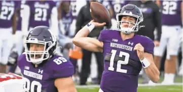  ?? DAVID BANKS/USA TODAY SPORTS ?? Northweste­rn quarterbac­k Peyton Ramsey isn't flashy, but the his steady hand and decision-making has made a huge difference in the team's turnaround this season.