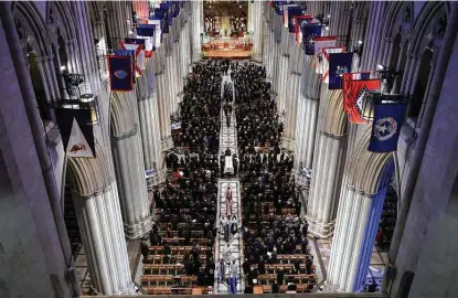  ?? Alex Wong / Getty Images ?? Clergy and others attend the funeral service of former Sen. Robert Dole at Washington National Cathedral. Dole, severely injured in World War II, was a Republican senator from Kansas from 1969 to 1996. He ran for president three times.
