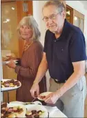  ?? Photo contribute­d ?? Jeanette Dunagan and a guest from Edmonton fill up at the dessert table at Silver Hills.