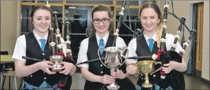  ??  ?? Amber MacDonald, Sine MacRae and Megan Campbell with their trophies.