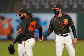  ?? AP PHOTO/ERIC RISBERG ?? San Francisco Giants starting pitcher Johnny Cueto (47) walks to the dugout after being removed by manager Gabe Kapler during the seventh inning of the team’s baseball game against the San Diego Padres on Saturday in San Francisco.