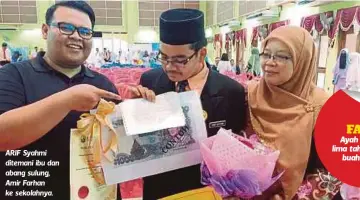  ??  ?? ARIF Syahmi ditemani ibu dan abang sulung, Amir Farhan ke sekolahnya.