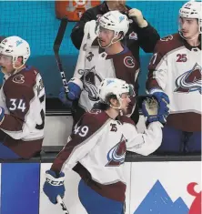  ?? Jeff Chiu / Associated Press ?? Samuel Girard receives congratula­tions after scoring in the third period to give the Avalanche a 20 lead over the Sharks.