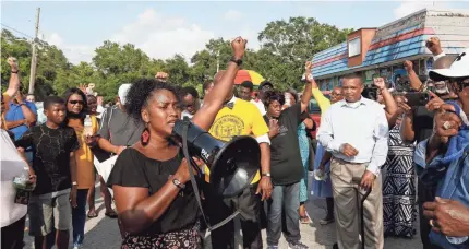  ?? LUIS SANTANA/AP ?? Ruth Beltran of Black Lives Matter Tampa rallies in Clearwater, Fla., site of last week’s fatal shooting.