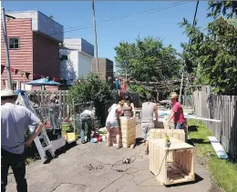  ??  ?? Lachine residents work to beautify one of the borough’s alleyways. The borough has launched the Programme de ruelles communauta­ires, which will distribute grants to help residents continue work on these alleyways.