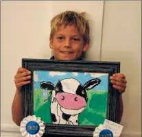  ?? NEWS PHOTOS SAMANTHA JOHNSON ?? Left: Alec Hargrave won the People’s Choice award in the Medicine Hat Stampede Children’s Visual Arts competitio­n.
Below: Alec accepts his cheque at the awards ceremony.