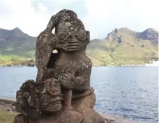  ?? DANIEL OTIS ?? A stone tiki idol stands beside the sea in the town of Taiohae, the largest settlement on the island of Nuku Hiva.