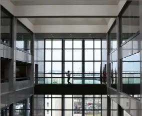  ?? Daniel Moore / Post-Gazette ?? A person walks through the Hart Senate Office Building in Washington in March. Capitol Hill has been almost totally shut down since mid-March, and lawmakers passed about $2.8 trillion in spending mostly confined to their homes.