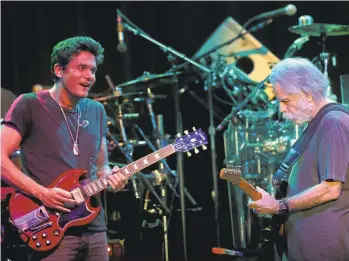  ?? JANE TYSKA/STAFF ARCHIVES ?? Newcomer John Mayer, left, jams with Bob Weir during the Dead & Company’s free “Pay It Forward” show in San Francisco in May. The band comes to Shoreline Amphitheat­re in Mountain View on Saturday.