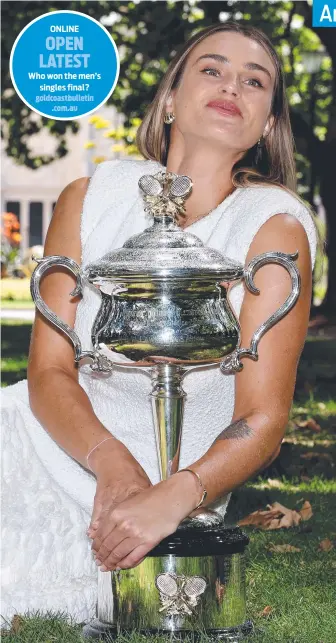  ?? ?? Aryna Sabalenka with the Australian Open trophy at Carlton Gardens yesterday. Picture: AFP