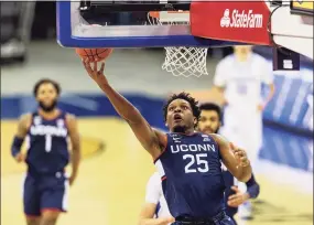  ?? John Peterson / Associated Press ?? UConn forward Josh Carlton (25) drives to the basket for a layup against Creighton on Jan. 23.