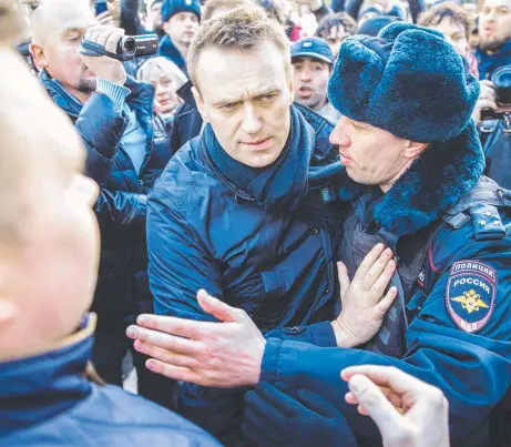  ?? PROTEST: Police officers detain Kremlin critic Alexei Navalny during an unauthoris­ed anti- corruption rally in central Moscow. Picture: AFP PHOTO/ EVGENY FELDMAN FOR ALEXEI NAVALNY'S CAMPAIGN ??