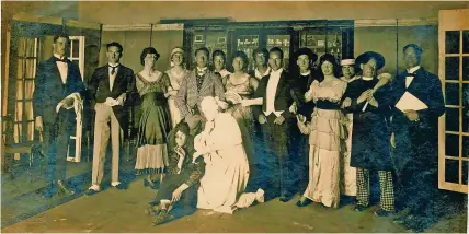  ?? ?? James Whale, seated at the front dressed as a gypsy, in a play produced by the prisoners of Holzminden POW Camp