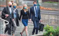  ?? Nic Coury / Associated Press ?? Elizabeth Holmes, center, walks into federal court in San Jose, Calif., on Thursday.