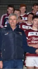  ??  ?? St. Martin’s joint captains, Conor Firman and Peter Barry, receiving the Pat White Memorial Cup from Bobby Goff (Coiste na nOg Chairman) and Alan Aherne (Group Sports Editor, People Newspapers).