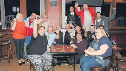  ?? Picture: George McLuskie. ?? Some BiFab workers celebrate the good news at the Brig Tavern in Methil.