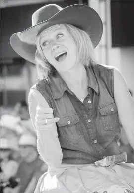  ??  ?? Alberta Premier Rachel Notley gives a thumbs-up during the Calgary Stampede parade on Friday.