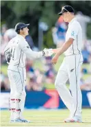  ?? Photo / Getty Images ?? BJ Watling salutes Kyle Jamieson at the end of play.