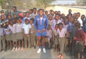  ?? Photo: Festus Hamalwa ?? Welcome back… Epifania Johannes and learners celebratin­g her two silver medals won at the World U15 Games in Serbia recently.