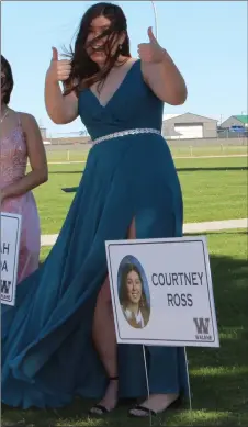  ??  ?? A little breeze didn’t stop Courtney Ross from enjoying her high school grad. Ross was one of 26 grads in western Canada to earn a major scholarshi­p.