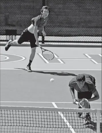  ?? DISPATCH ?? SAM GREENE Columbus Academy’s Ryan Jung serves past doubles partner Shrikar Kundur in a loss to a team from Cincinnati Country Day in the Division II final.