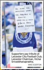  ?? MIKE EGERTON ?? Supporters pay tribute at Leicester City Football Club. Leicester Chairman, Vichai Srivaddhan­aprabha.