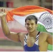  ?? — Reuters ?? Narsingh Yadav celebrates winning the gold medal in the 74 kg men’s freestyle wrestling match at the Commonweal­th Games.