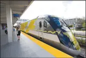  ?? WILFREDO LEE / ASSOCIATED PRESS FILE (2018) ?? A Brightline train is shown Jan. 11, 2018, at a station in Fort Lauderdale, Fla. Brightline West, a private company, is on an ambitious schedule to build a high-speed rail line between Las Vegas and the Los Angeles area, using private and federal funds.