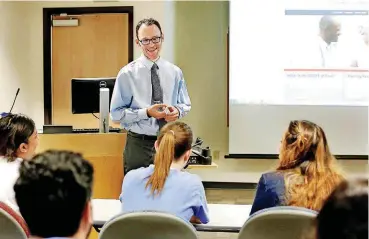  ?? [PHOTO BY JIM BECKEL, THE OKLAHOMAN] ?? Dr. Bryan Billings, a family medicine physician, talks with residents about treating patients for pain during a class at the University of Oklahoma College of Medicine.