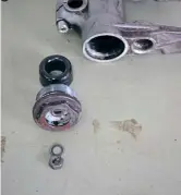  ??  ?? Nut, washer, end cap, bump stop and fork lower