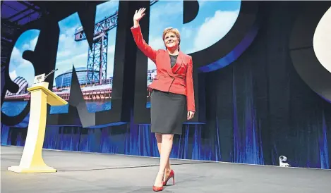  ?? Picture: Getty Images. ?? Nicola Sturgeon waves to delegates at the party conference in Glasgow.