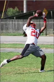  ??  ?? Atkins senior Donovan Nooner hauls in a pass during a practice Aug. 13.