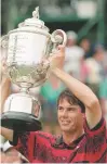  ?? ASSOCIATED PRESS FILE PHOTO ?? Paul Azinger holds up the trophy after winning the 75th PGA Championsh­ip on Aug. 15, 1993, at Inverness Club in Toledo, Ohio. Azinger was diagnosed with cancer three months after winning his only major.