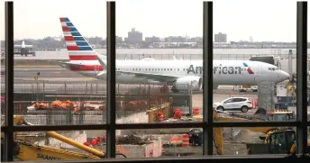  ?? — AFP photo ?? File photo shows an American Airlines 737 Max sitting at the gate at LaGuardia airport in New York.