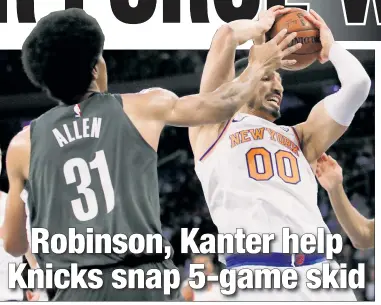  ??  ?? CHAIRMAN OF THE BOARD: Enes Kanter, who finished with 15 points and 15 rebounds, battles for a rebound with Jarrett Allen during the Knicks’ 115-96 victory over the Nets on Monday.