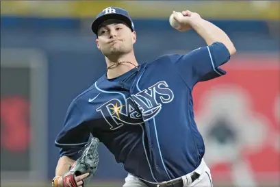  ?? ?? The Associated Press
Tampa Bay Rays starting pitcher Shane McClanahan pitches to the Toronto Blue Jays during the first inning of a baseball game Wednesday, in St. Petersburg, Fla.