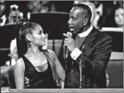  ?? PAUL SANCYA/AP ?? Bishop Charles Ellis III, holds Ariana Grande after her song Friday at the funeral service for Aretha Franklin in Detroit.