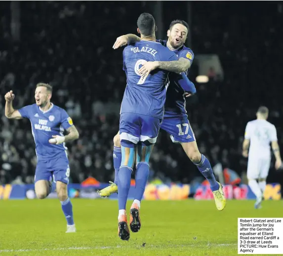  ??  ?? Robert Glatzel and Lee Tomlin jump for joy after the German’s equaliser at Elland Road earned Cardiff a 3-3 draw at Leeds PICTURE: Huw Evans Agency