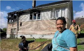  ?? PHOTOS: VIRGINIA FALLON/FAIRFAX NZ ?? Brave smile: Vasati Lopati lost everything in a fire at her rented home.