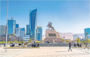  ??  ?? Sukhbaatar Square with the statue of the Mongolian revolution­ary hero Damdinii Sükhbaatar in Ulaanbaata­r.