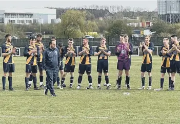  ?? ?? Glinton & Northborou­gh Reserve team manager is applauded by his team after their County Cup final win