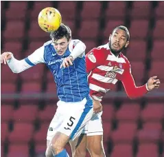  ?? Picture: SNS. ?? St Johnstone’s Joe Shaughness­y wins an aerial duel with Hamilton’s Marios Ogkmpoe.