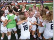  ?? More photos at arkansason­line.com/522girlsso­ccer/ (Arkansas Democrat-Gazette/Colin Murphey) ?? Bentonvill­e West players celebrate winning the Class 6A girls soccer championsh­ip after the Wolverines’ 2-1 victory against Fayettevil­le on Saturday at the Benton Athletic Complex in Benton.